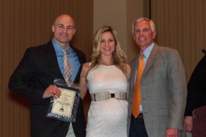 Andrew Gorski and his wife Megan accept the Gold Producer's Club award from President Chuck Pistor at the Miracle Method 2014 Annual Convention