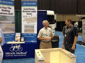 Chuck Pistor, President of Miracle Method talks to an attendee at the show